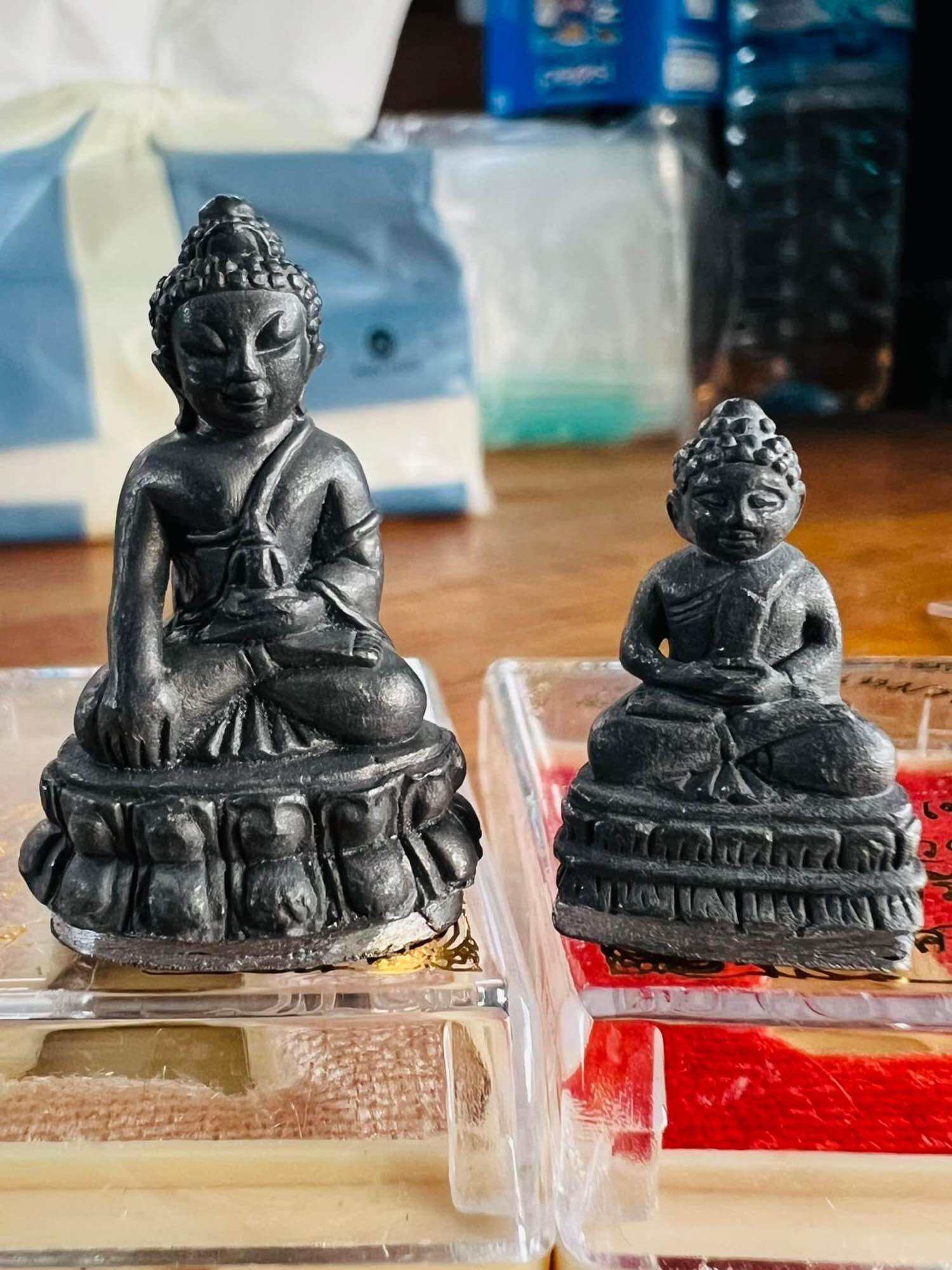 Mongkol Hemarat Kring spiritual charm black metal Buddha amulets on clear display stands for home altar
