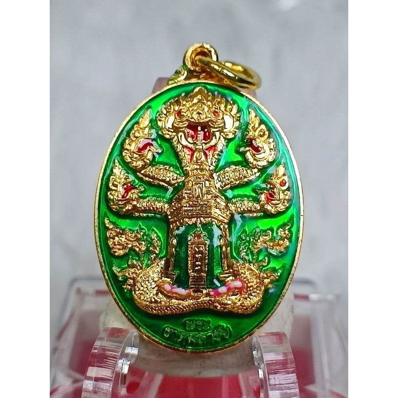 Wat That Mahachai authentic amulet with intricate gold design on green background from Thai Blessing Co