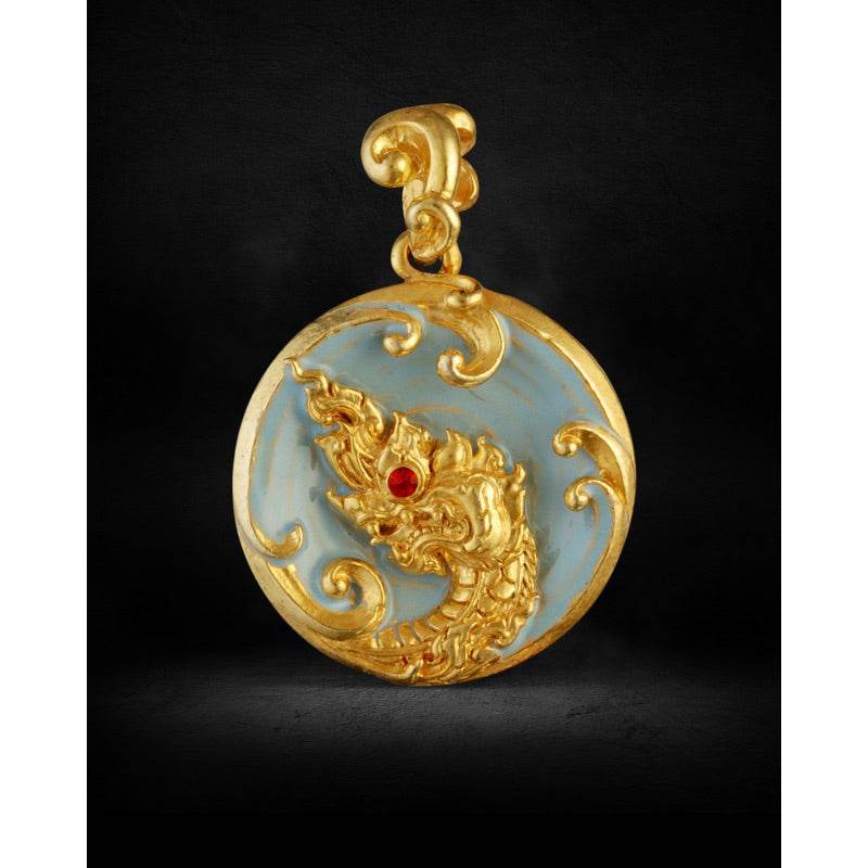 Gold Naga head pendant on pale blue disc with red gemstone eye ornate bail Thai Blessing Co Naga Bak amulet Thailand