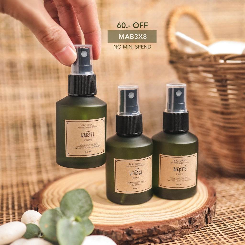Wedding gift set for newlyweds featuring natural air freshener sprays in green bottles on wooden tray