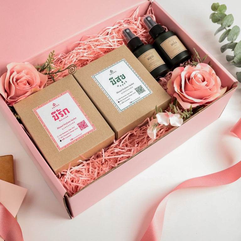 One-Sake.com wedding gift set for newlyweds with scented candles and essential oil sprays in a pink box