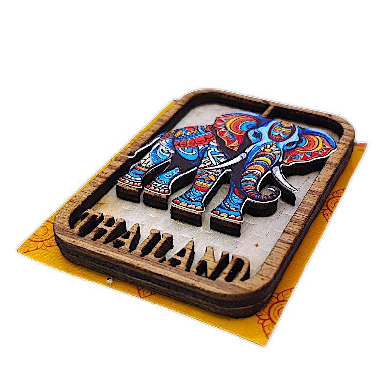 Colorful wooden Thailand souvenir magnets featuring an intricately painted elephant design