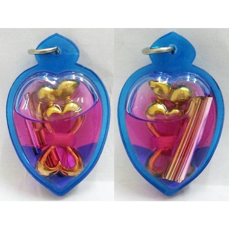 Yin Koo twin lovers amulet in colorful casing for love and relationship enhancement