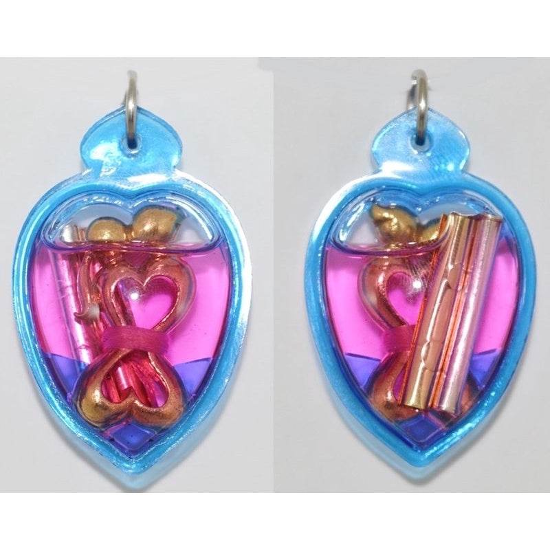 Yin Koo twin lovers amulet in heart-shaped casing with colorful design for love and harmony