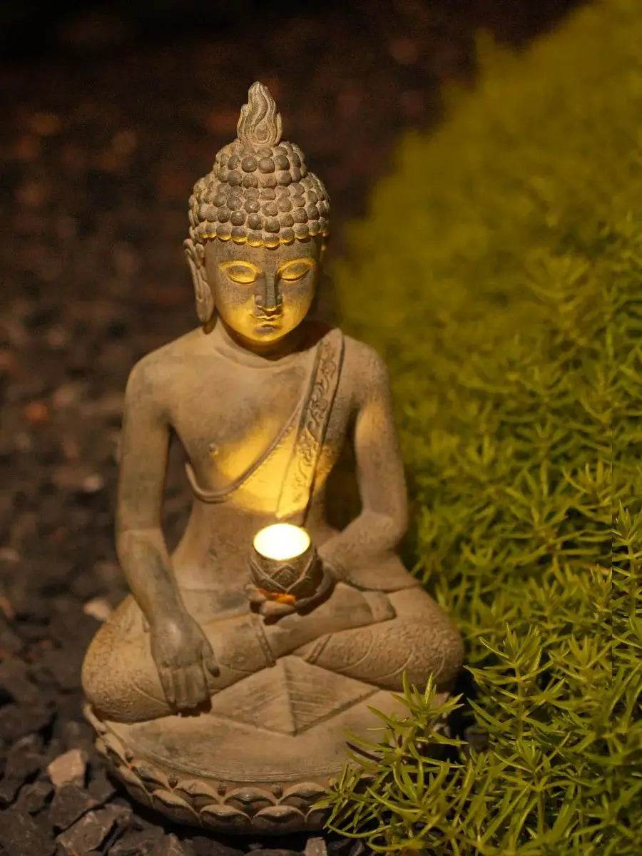 Thai Blessing Co solar powered Buddha garden statue stone seated Buddha holding a glowing tea light