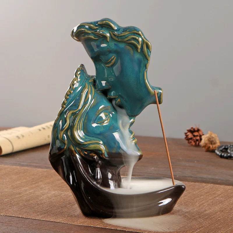 Teal and black ceramic dual face sculpture with cascading smoke and stick incense backflow incense burner for home