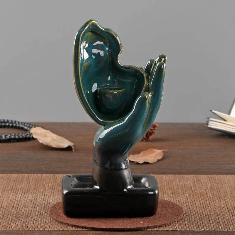 Thai Blessing Co teal ceramic hand shaped backflow incense burner for home on black base for meditation