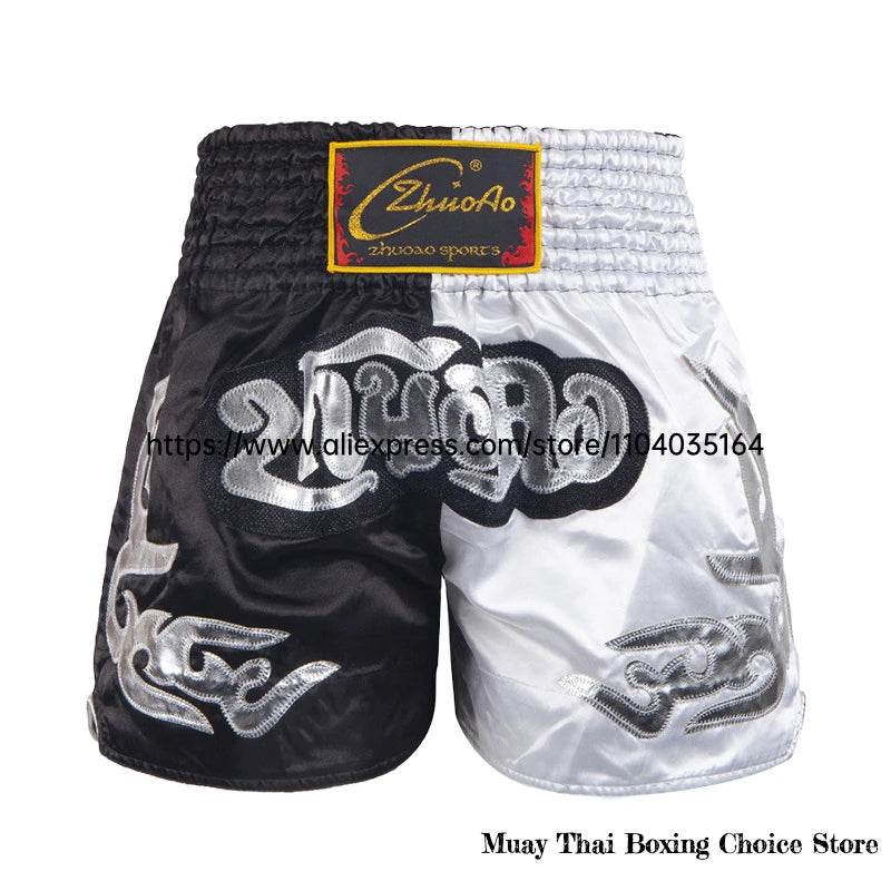 Muay Thai shorts Thailand black and white satin fight shorts with embroidered Thai motifs and elastic waistband